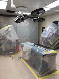More examples of plastic sheeting protects medical equipment from duct and debris during the air duct cleaning service
