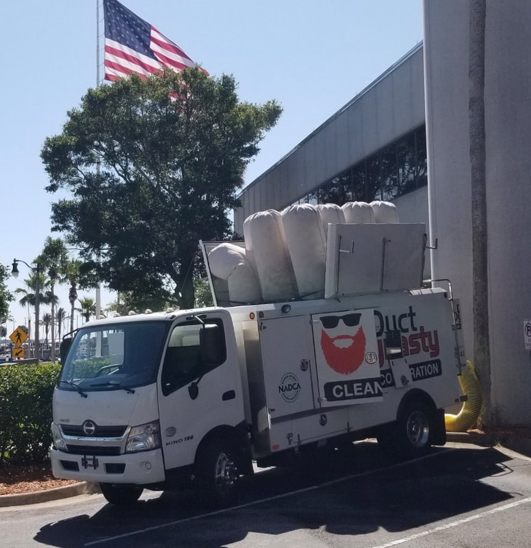 State-of-the-art air duct cleaning truck, used to reduce dust and debris, completely removing it from the building