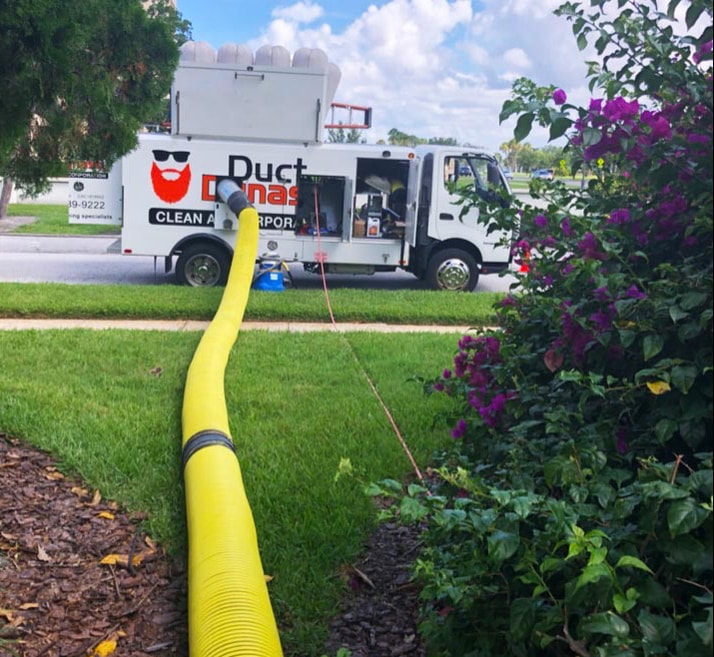 Duct truck parked outside a home during an air duct cleaning service.